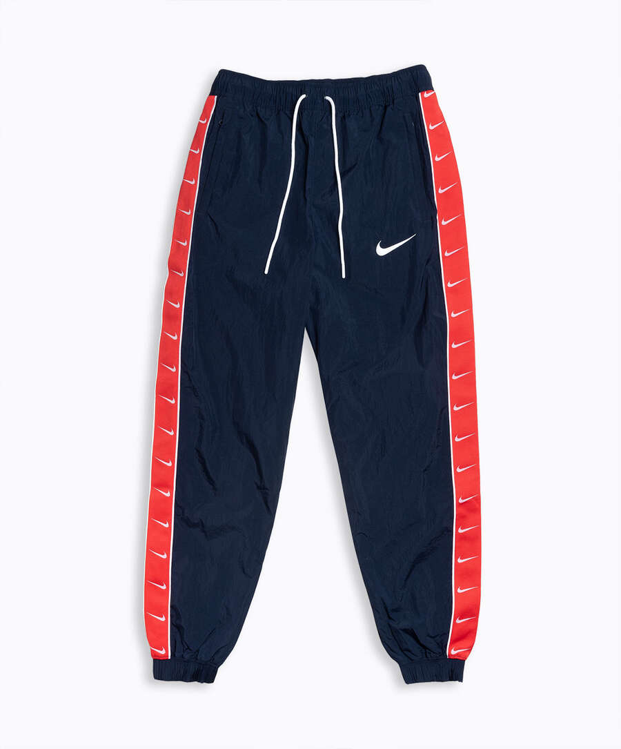 Familiarizarse cebra vapor Pantalón Nike Sportswear Swoosh Woven Azul CD0421-451| Comprar Online en  FOOTDISTRICT